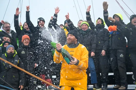 LES SABLES D'OLONNE, FRANCE - 31 JANVIER 2025 : GUYOT Environnement - Le skipper de Water Family Benjamin Dutreux (FRA)) fête au champagne au ponton sa 10ème place au Vendée Globe, le 31 janvier 2025 aux Sables d'Olonne, France - (Photo by Olivier Blanchet / Alea)